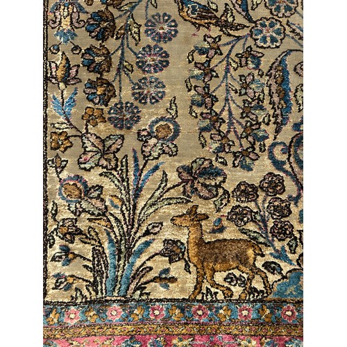 204 - A FINE TURKISH SILK HEREKE RUG DEPICTING THE TREE OF LIFE AND BIRD FIELD WITH FOLIATE BORDER

210cm ... 