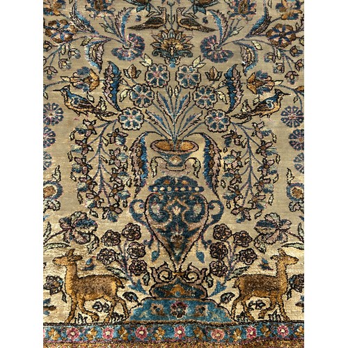 204 - A FINE TURKISH SILK HEREKE RUG DEPICTING THE TREE OF LIFE AND BIRD FIELD WITH FOLIATE BORDER

210cm ... 