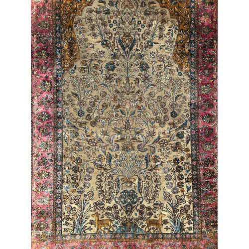 204 - A FINE TURKISH SILK HEREKE RUG DEPICTING THE TREE OF LIFE AND BIRD FIELD WITH FOLIATE BORDER

210cm ... 