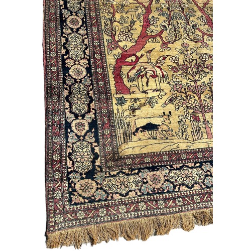 205 - A FINE TURKISH PICTORIAL RUG DEPICTING SMALL BIRDS CRANES AND CATTLE WITH FOLIATE BORDER

205cm x 13... 