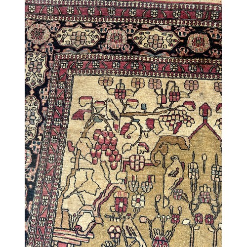 205 - A FINE TURKISH PICTORIAL RUG DEPICTING SMALL BIRDS CRANES AND CATTLE WITH FOLIATE BORDER

205cm x 13... 