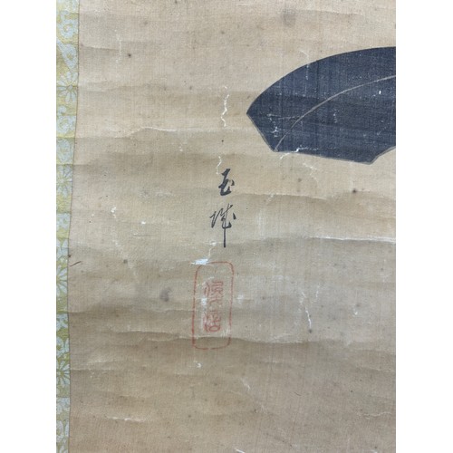 82 - A JAPANESE SCROLL PAINTING ON SILK DEPICTING A KIBUTO HELMET, character seals and calligraphy bottom... 