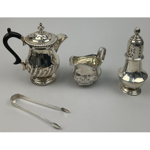 60 - VARIOUS SILVER ITEMS, to include a tea pot, milk pail, sugar shaker and tongs (4)

Various silversmi... 