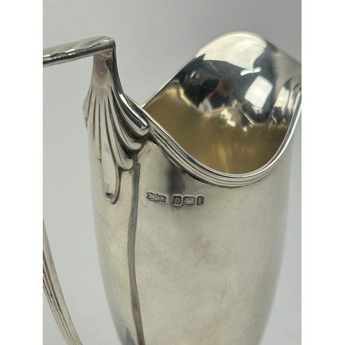 61 - A VICTORIAN SILVER CUP BY JAMES DEAKIN AND SONS, with large handle mounted on a base.

Total weight:... 