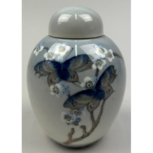 231 - A ROYAL COPENHAGEN PORCELAIN JAR AND LID DECORATED WITH BUTTERFLIES