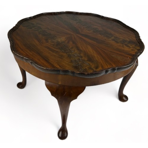 198 - A REPRODUCTION LOW TABLE, raised on four cabriole legs