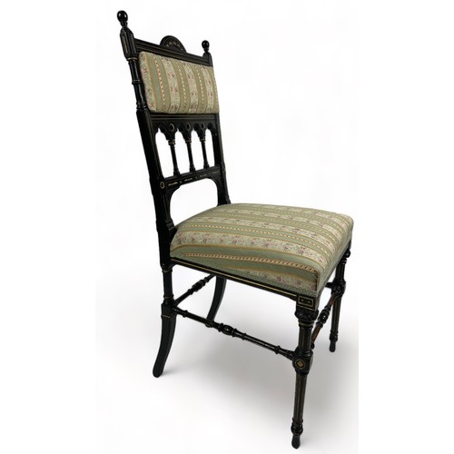 180 - A PAIR OF AESTHETIC MOVEMENT EBONISED SIDE CHAIRS OF GOTHIC DESIGN, with pierced back rail of shaped... 