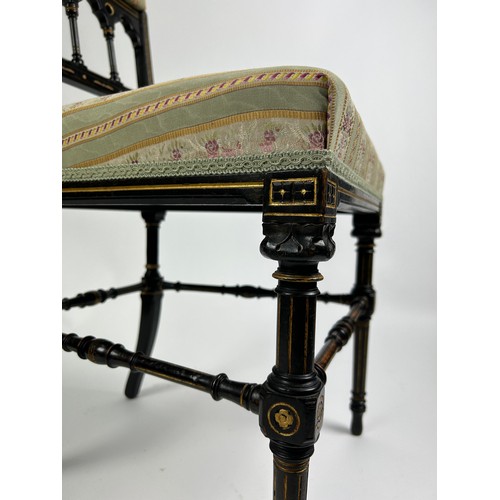 180 - A PAIR OF AESTHETIC MOVEMENT EBONISED SIDE CHAIRS OF GOTHIC DESIGN, with pierced back rail of shaped... 