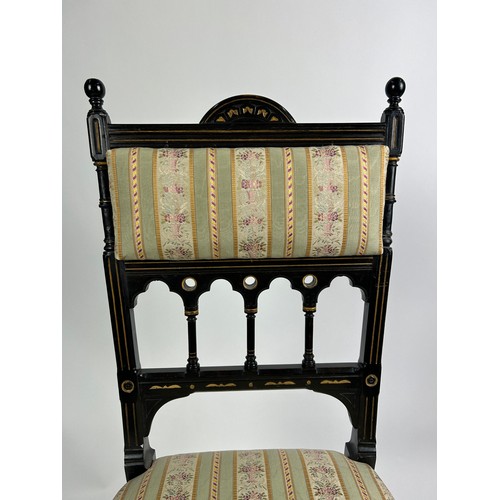 180 - A PAIR OF AESTHETIC MOVEMENT EBONISED SIDE CHAIRS OF GOTHIC DESIGN, with pierced back rail of shaped... 