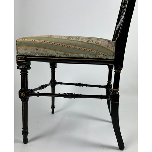 180 - A PAIR OF AESTHETIC MOVEMENT EBONISED SIDE CHAIRS OF GOTHIC DESIGN, with pierced back rail of shaped... 