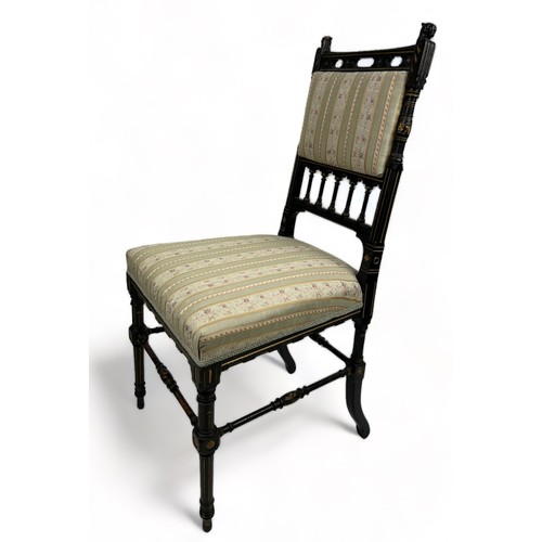 181 - AN AESTHETIC MOVEMENT EBONISED SIDE CHAIR OF GOTHIC DESIGN, with pierced back rail of shaped arches ... 