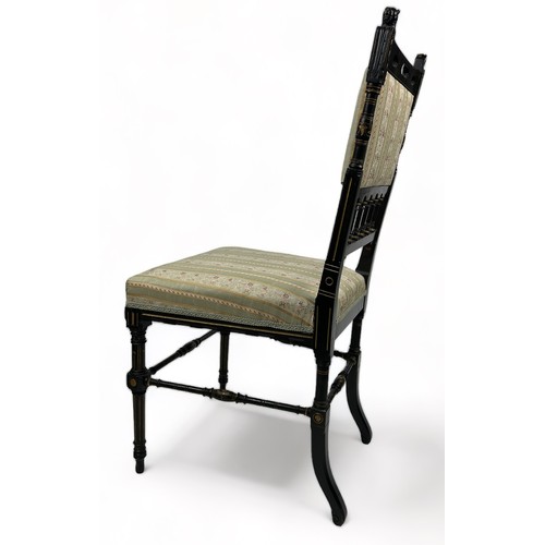 181 - AN AESTHETIC MOVEMENT EBONISED SIDE CHAIR OF GOTHIC DESIGN, with pierced back rail of shaped arches ... 