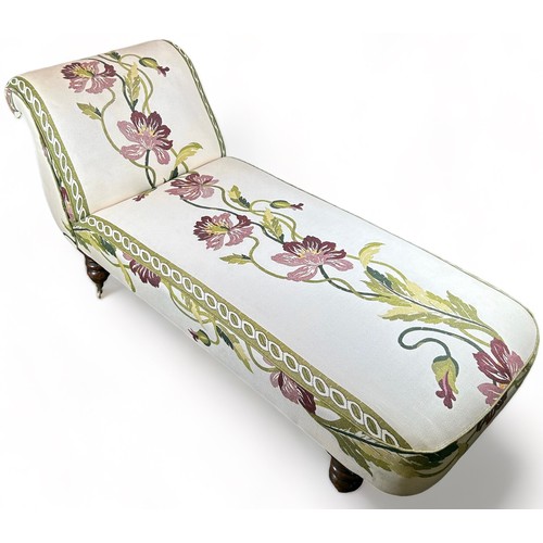 183 - A VICTORIAN CHAISE LOUNGE UPHOLSTERED IN CONTEMPORARY FABRIC OF FOLIATE DESIGN, raised on baluster l... 