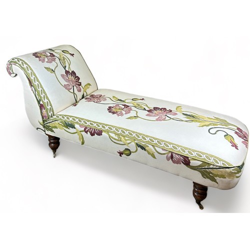 183 - A VICTORIAN CHAISE LOUNGE UPHOLSTERED IN CONTEMPORARY FABRIC OF FOLIATE DESIGN, raised on baluster l... 