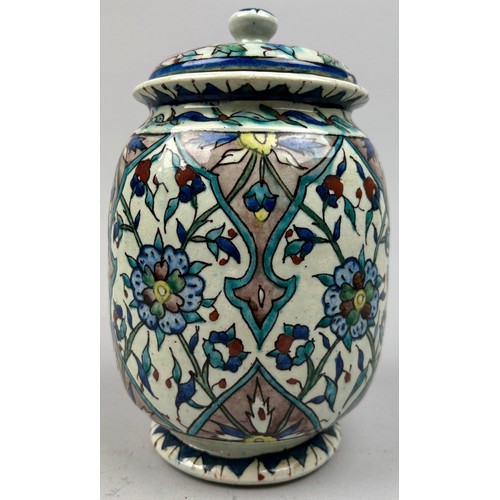 228 - AFTER WILLIAM DE MORGAN (1839-1917), jar and cover painted in the iznik palette raised on a circular... 