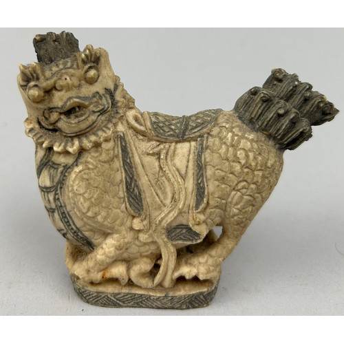 77 - A CHINESE SEAL IN THE FORM OF A TEMPLE LION, probably 20th Century

9cm x 8cm