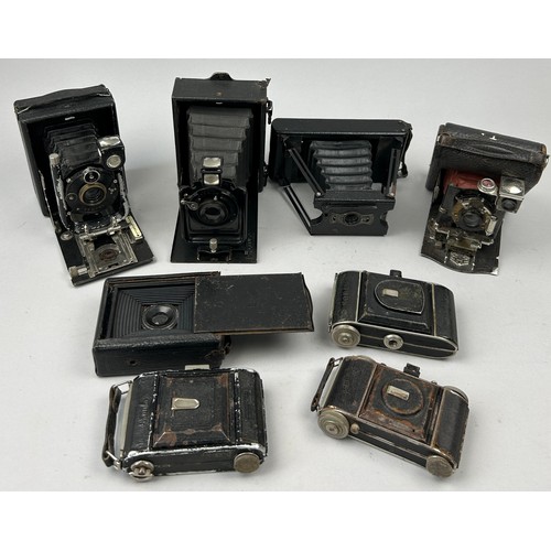 244 - A COLLECTION OF EIGHT DECORATIVE VINTAGE CAMERAS