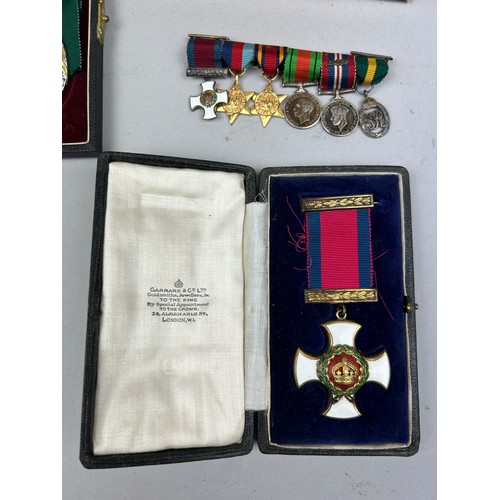 66 - A DISTINGUISHED SERVICE ORDER MEDAL (DSO) IN ORIGINAL GARRARD AND CO CASE, along with a territorial ... 