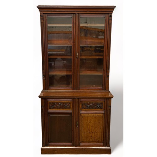 194 - A VICTORIAN MAHOGANY BOOKCASE,

The upper section consisting of two glazed doors with four inner she... 