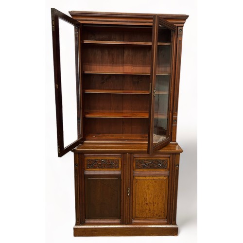 194 - A VICTORIAN MAHOGANY BOOKCASE,

The upper section consisting of two glazed doors with four inner she... 