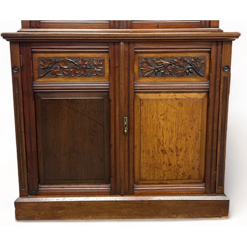 194 - A VICTORIAN MAHOGANY BOOKCASE,

The upper section consisting of two glazed doors with four inner she... 