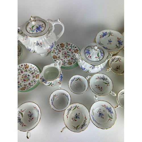 232 - A LARGE MIXED TEA SERVICE, including saucers by Minton 'Haddon Hall' and cups, saucers, tea pots, pl... 