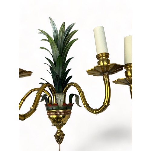 216 - ATTRIBUTED TO MAISON CHARLES A PAIR OF HOLLYWOOD REGENCY TOLEWARE AND BRASS PINEAPPLE WALL SCONCES, ... 