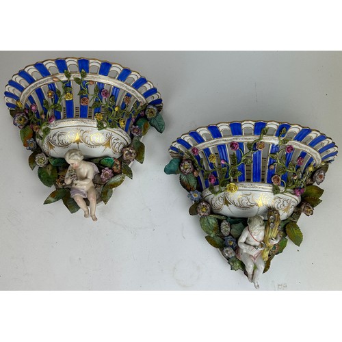 236 - A PAIR OF DECORATIVE FLOWER BASKETS, each with porcelain basket decorated with toleware flowers and ... 