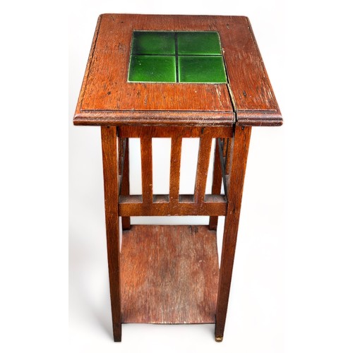 201 - A JARDINIERE STAND INSET WITH A GREEN GLAZED TILE

87cm in height

**Please note this lot will be av... 