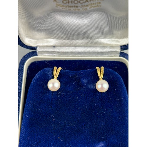 32 - A PAIR OF GOLD AND PEARL EARRINGS, 

Housed within a blue velvet case. 

Total weight 3.5gms 

1.5mm... 