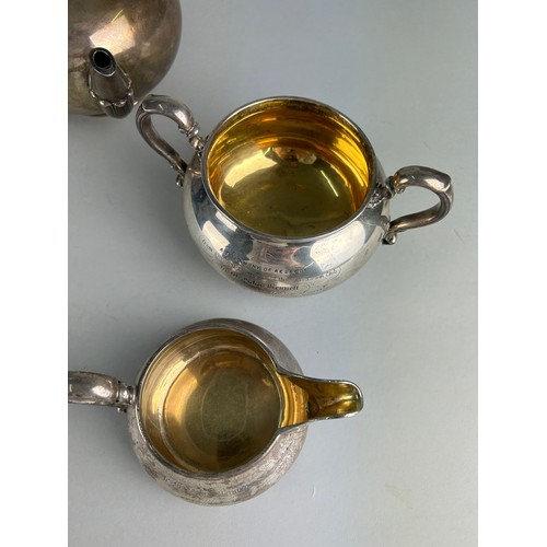 61 - A SILVER AND GILT TEA SET BY ROBERT GARRARD II GIFTED FROM THE ATHENEUM CLUB IN PALL MALL TO THE BUT... 