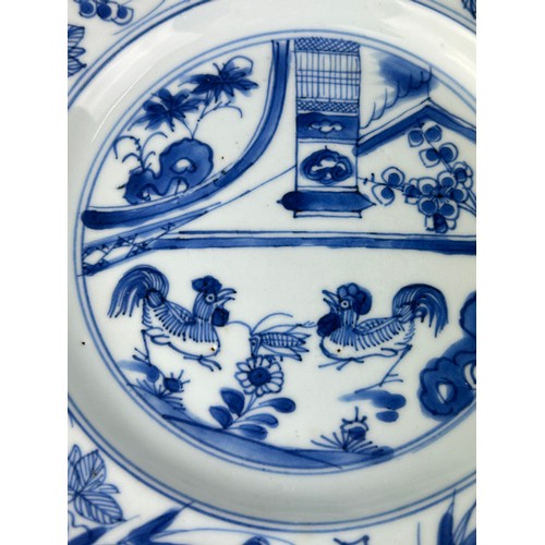 86 - A PAIR OF CHINESE KANGXI PERIOD (1662-1722) 'CHICKEN DISHES', 

Blue and white painted with scenes o... 