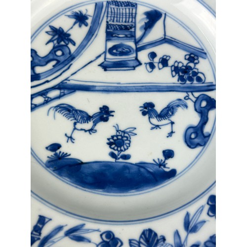 86 - A PAIR OF CHINESE KANGXI PERIOD (1662-1722) 'CHICKEN DISHES', 

Blue and white painted with scenes o... 
