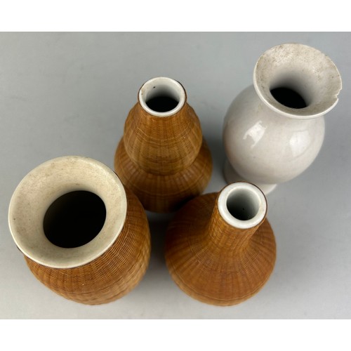 92 - A GROUP OF FOUR SMALL CHINESE CELADON BOTTLES, three wrapped in cane.

Tallest 11cm H
