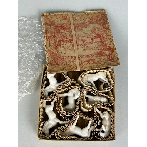 112 - A CHINESE MARBLE PLAQUE, along with a box of Chinese white ceramic horses and a cloisonné dragon pen... 