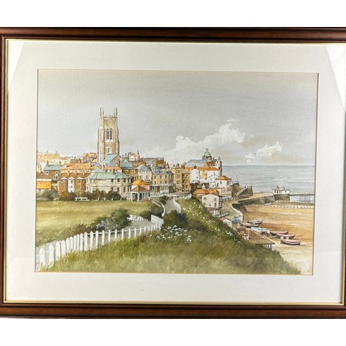 298 - A WATERCOLOUR ON PAPER OF A COASTAL TOWN WITH BEACH AND SEA IN THE DISTANCE, 

Unsigned. Mounted in ... 