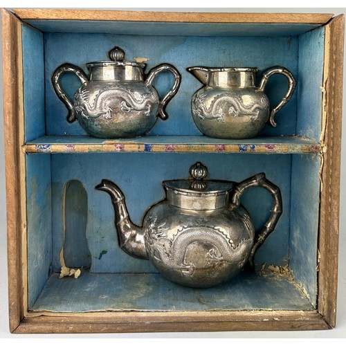 63 - A CHINESE EXPORT SILVER TEA SET WITH FOUR CLAWED DRAGONS MARKED HC MOST PROBABLY HUNG CHONG AND CO O... 