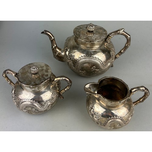 63 - A CHINESE EXPORT SILVER TEA SET WITH FOUR CLAWED DRAGONS MARKED HC MOST PROBABLY HUNG CHONG AND CO O... 