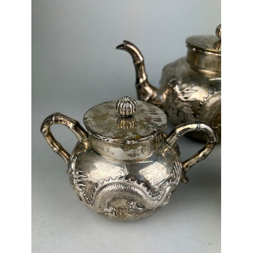 63 - A CHINESE EXPORT SILVER TEA SET WITH FOUR CLAWED DRAGONS MARKED HC MOST PROBABLY HUNG CHONG AND CO O... 