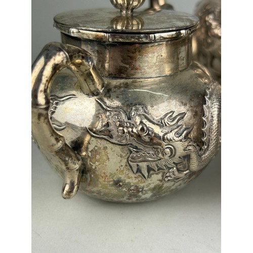 63 - A CHINESE EXPORT SILVER TEA SET WITH FOUR CLAWED DRAGONS MARKED HC MOST PROBABLY HUNG CHONG AND CO O... 