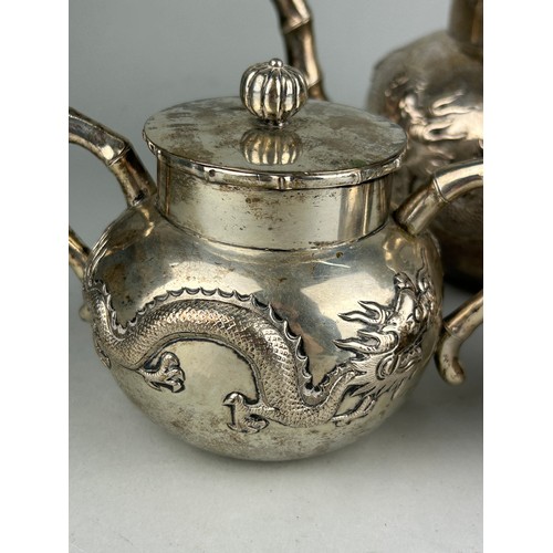 63 - A CHINESE EXPORT SILVER TEA SET WITH FOUR CLAWED DRAGONS MARKED HC MOST PROBABLY HUNG CHONG AND CO O... 