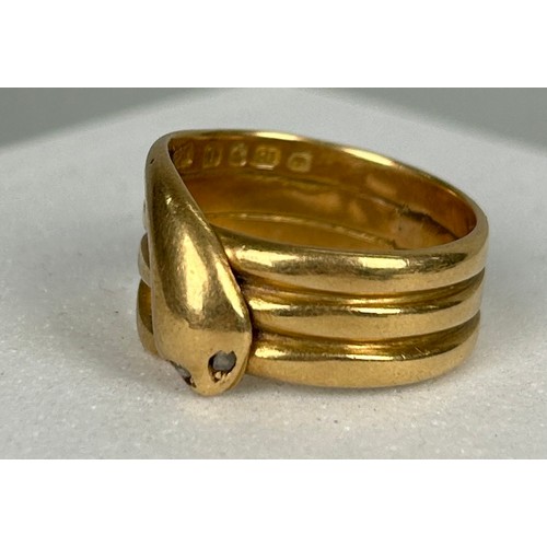 42 - AN 18CT GOLD RING IN THE FORM OF A SNAKE WITH TWO SMALL DIAMONDS FOR EYES, 

Weight: 10.8gms