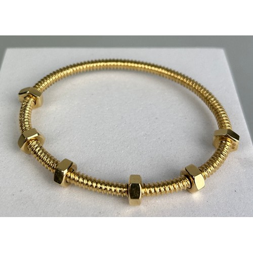 3 - AN 18CT GOLD ECROU DE CARTIER BRACELET,

Weight: 29.2gms

6.8cm in diameter.