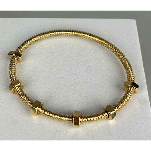 3 - AN 18CT GOLD ECROU DE CARTIER BRACELET,

Weight: 29.2gms

6.8cm in diameter.