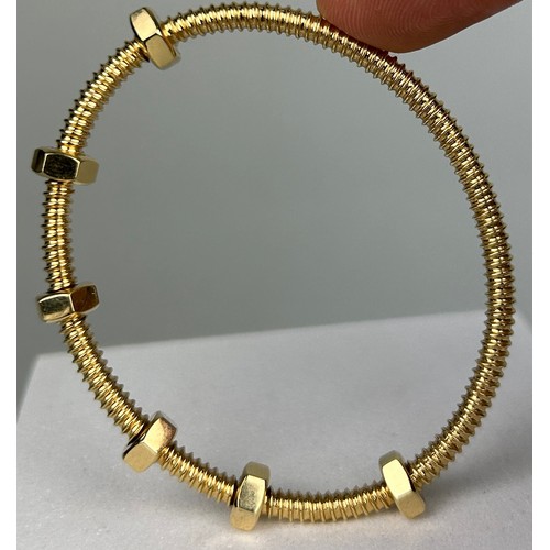 3 - AN 18CT GOLD ECROU DE CARTIER BRACELET,

Weight: 29.2gms

6.8cm in diameter.