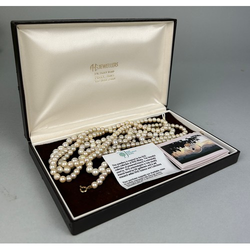 32 - A STRING CULTURED PEARL NECKLACE WITH 9CT GOLD CLASPS, together with a shorter necklace, a bracelet ... 