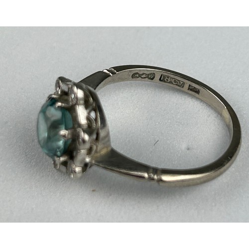 35 - AN 18CT WHITE GOLD RING inset with an blue topaz stone mounted in a hexagonal setting with six diamo... 