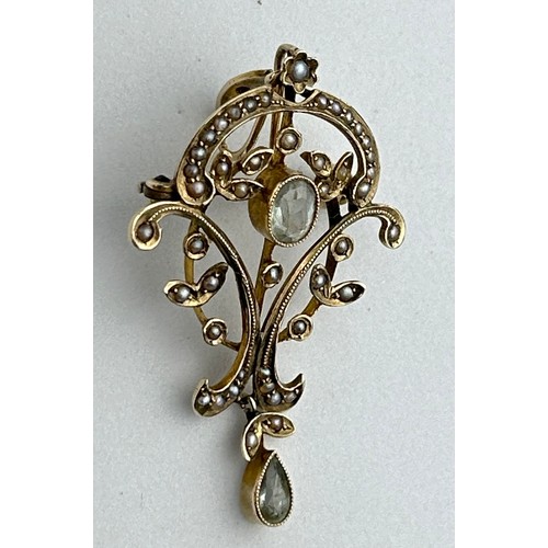 12 - A LATE GEORGIAN OR EARLY VICTORIAN PENDANT OF FLORAL AND LEAF DESIGN, set with a central oval cut aq... 