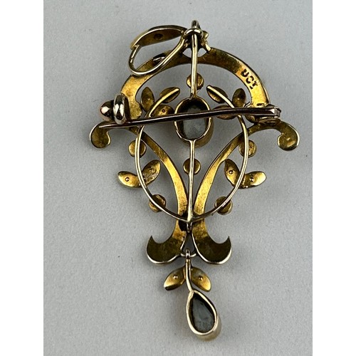 12 - A LATE GEORGIAN OR EARLY VICTORIAN PENDANT OF FLORAL AND LEAF DESIGN, set with a central oval cut aq... 