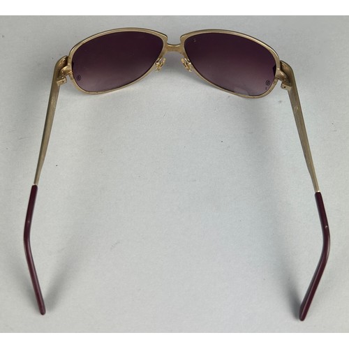 57 - A PAIR OF CARTIER EDITION C GOLD COLOUR RIMMED SUNGLASSES, with faux burgundy crocodile skin detail,... 